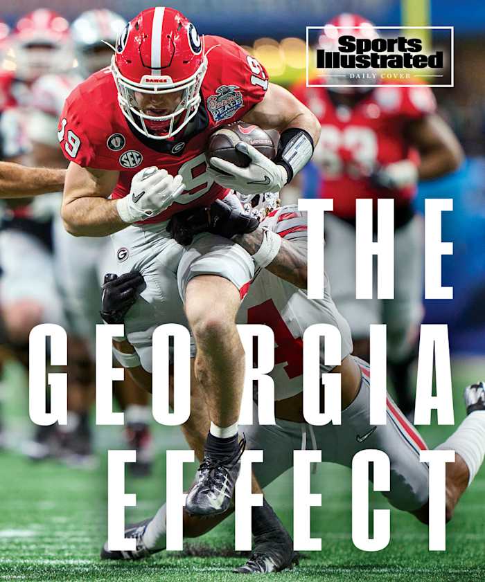 Georgia’s Brock Bowers barrels through the Ohio State defense.